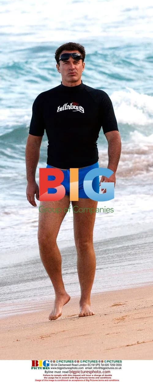 Julian McMahon and girlfriend at beach