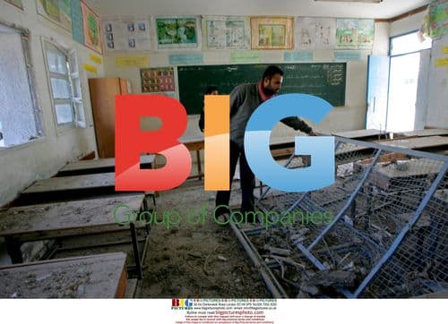 Palestinian boy inspects damage to UN school in Gaza