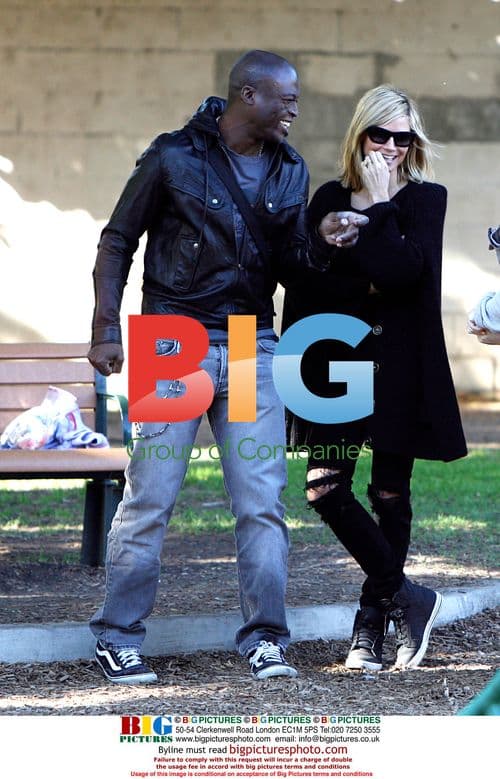 Heidi Klum and Seal with children in park