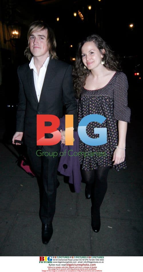 Tom Fletcher and female friend leaving party