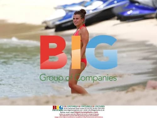 Coleen Rooney Strolls on Caribbean Beach