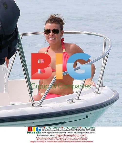 Coleen Rooney Strolling on Caribbean Beach