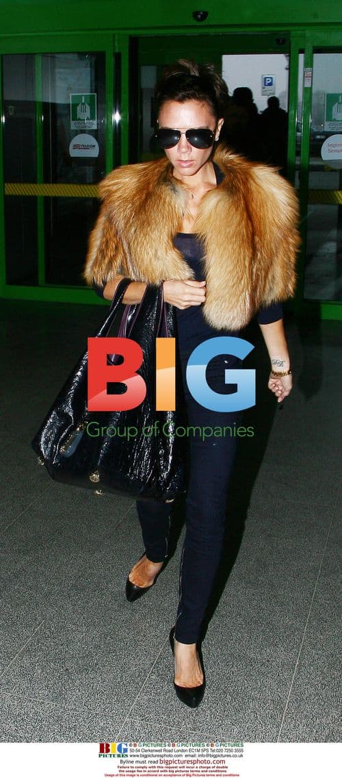 Victoria Beckham Arrives at Milan Airport