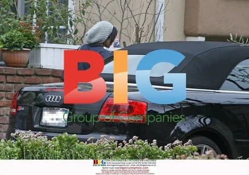 Vanessa Hudgens hides with ice cream cone