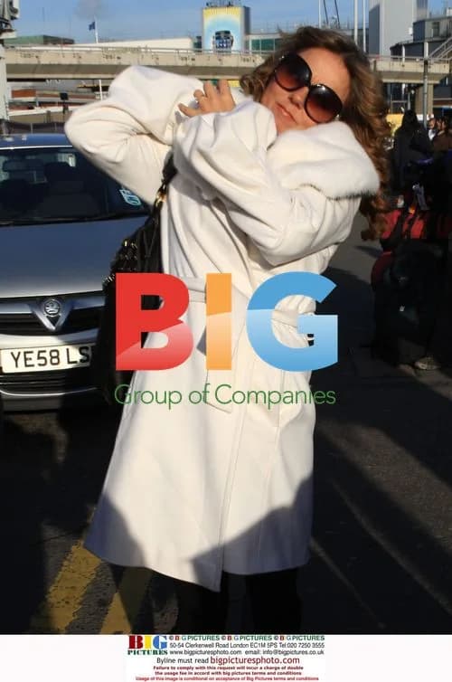 Geri Halliwell Arrives at Heathrow with Ring