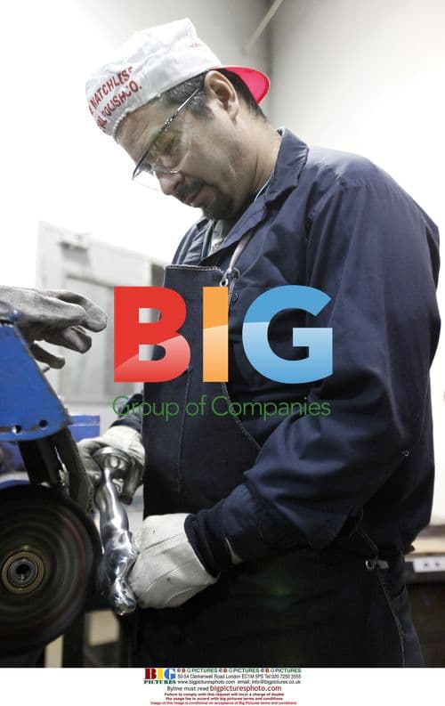 Eladio Gonzales polishes Oscar statuette