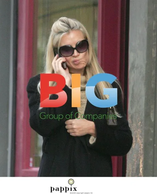 Caprice Bourret picks up dog from vet