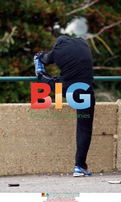 Peter Andre jogging in black tracksuit