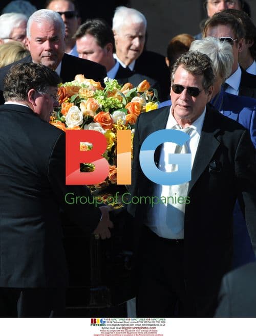 Ryan O'Neal carries Farrah Fawcett's casket after funeral