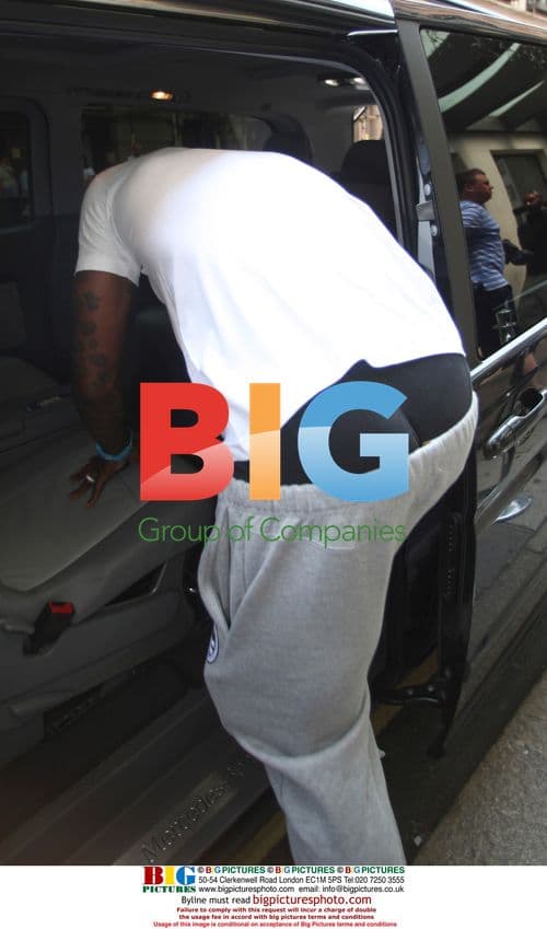 Footballer Djibril Cisse and wife Jude outside Mayfair Hotel