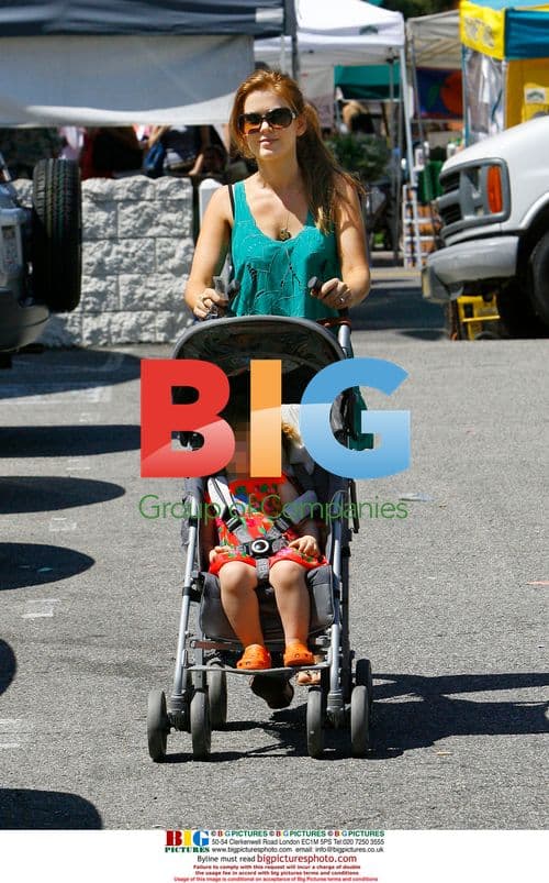 Isla Fisher and daughter at farmers market