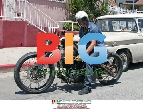 Brad Pitt Breaks Down on Vintage Motorcycle