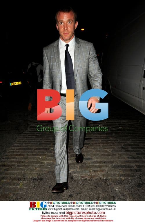 Guy Richie leaves Prada party with mystery lady