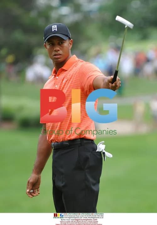 Tiger Woods celebrates 2nd green putt