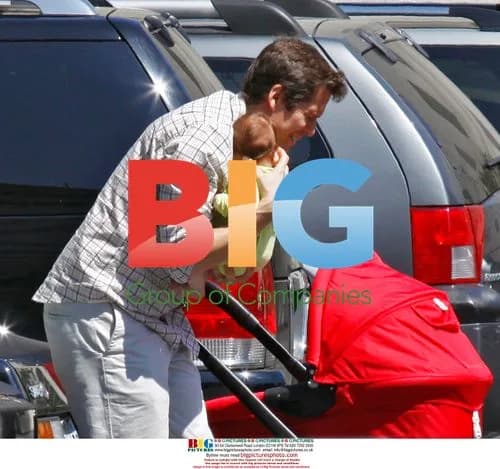 Alexis Denisof and Alyson Hannigan with baby
