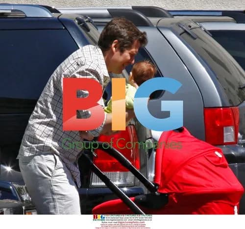 Alexis Denisof and Alyson Hannigan with baby
