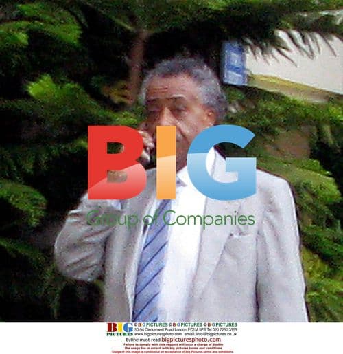 Al Sharpton seen on phone outside hotel