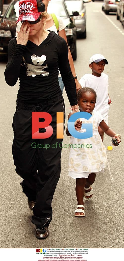 Madonna with adopted children in London