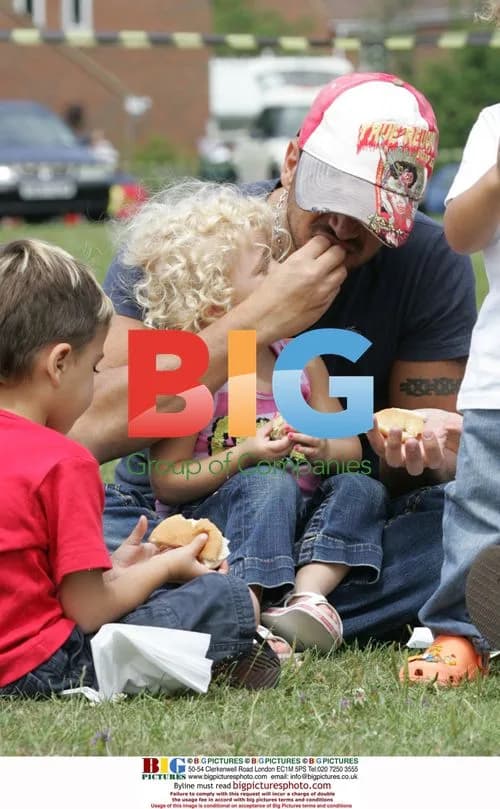 Peter Andre at a fair with kids