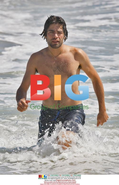 Adrien Grenier body-boarding in Malibu
