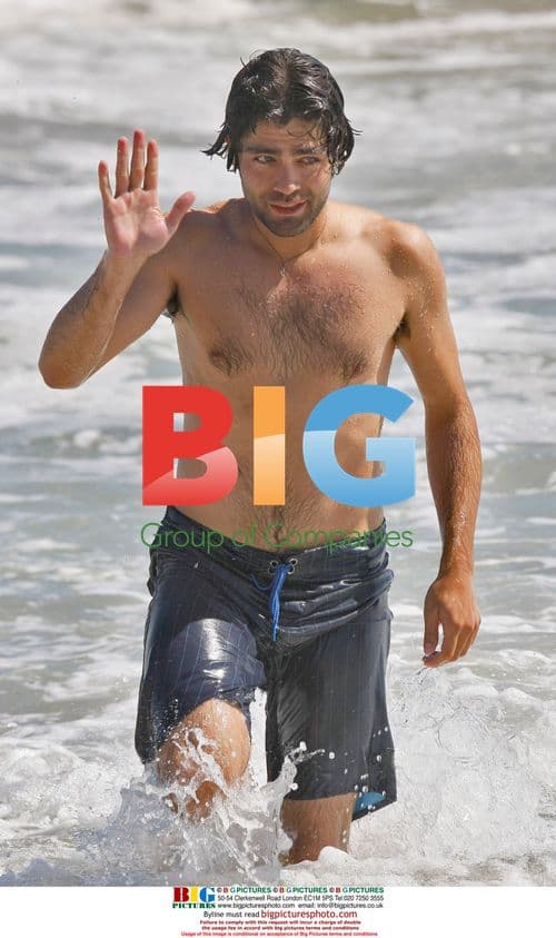 Adrien Grenier body-boarding in Malibu