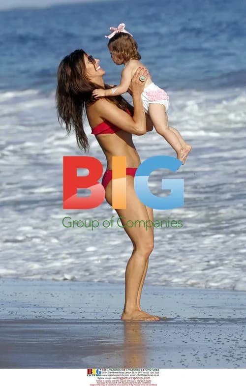 Ali Landry and daughter on Malibu beach