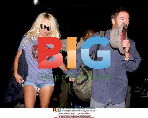 Pamela Anderson and boyfriend arrive at LAX