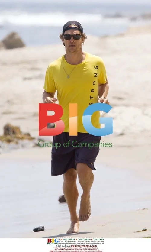 Actor Matthew McConaughey jogs on California beach
