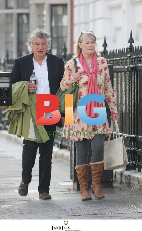 Sue Cook goes shopping with husband in London