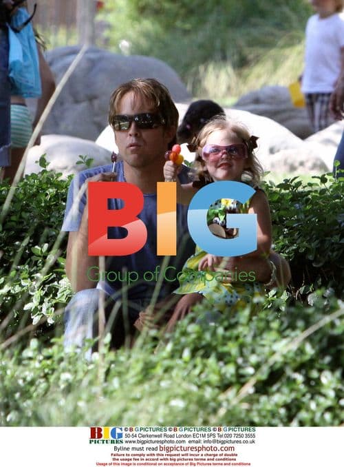 Larry Birkhead and daughter Dannielynn play at park
