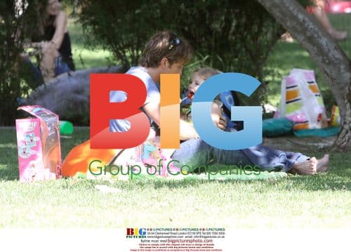 Larry Birkhead and daughter Dannielynn play at Beverly Hills park