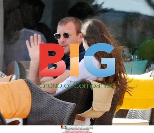 Guy Ritchie relaxes with twins in Italy