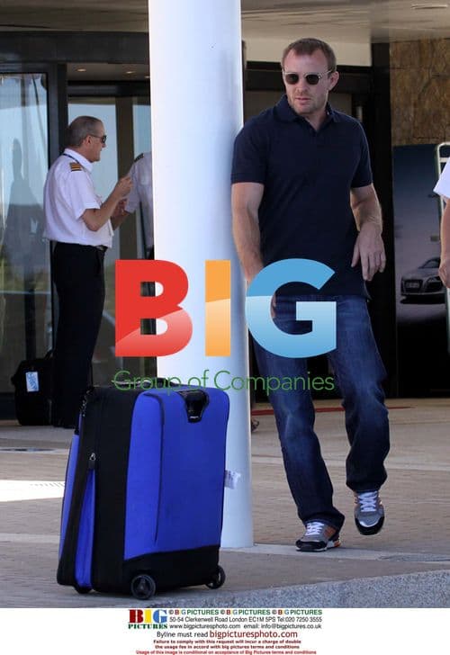 Guy Ritchie Relaxes with Twins on Holiday