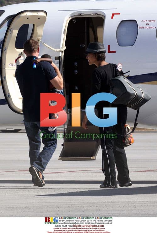 Guy Ritchie relaxes with twins on holiday