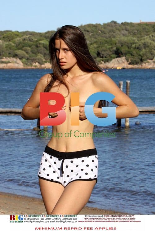 Model twin sisters posing on the beach