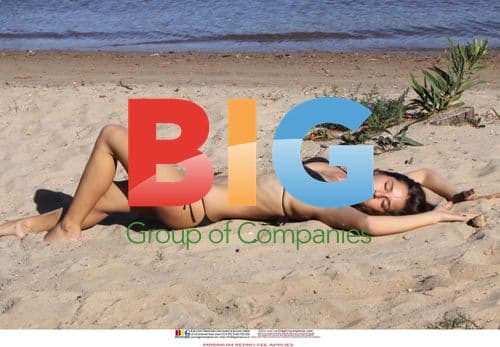 Twin Sisters Posing Sexily on Beach