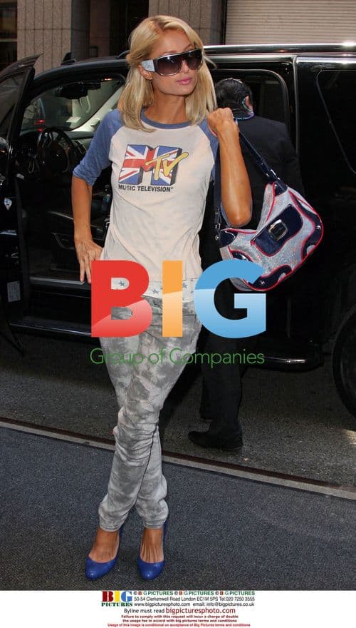 Paris Hilton Poses for Photographers