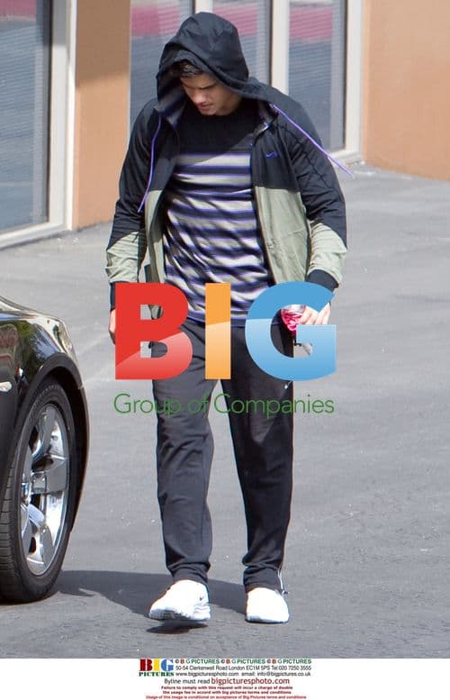 Taylor Lautner and father leaving gym