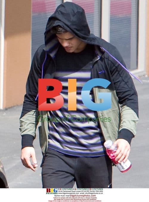 Taylor Lautner and his father leaving gym