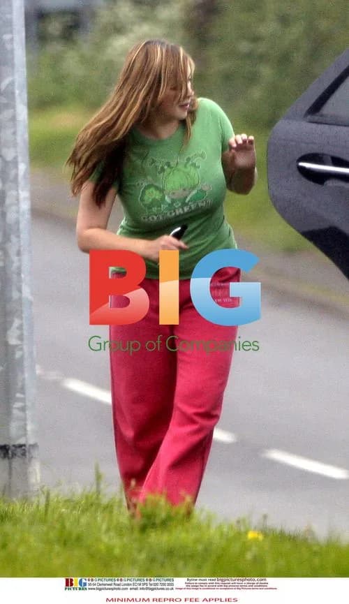 Charlotte Church out in rainy weather
