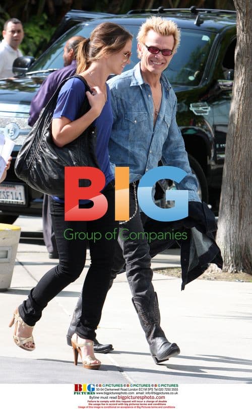 Billy Idol and female arrive at NBA Finals game