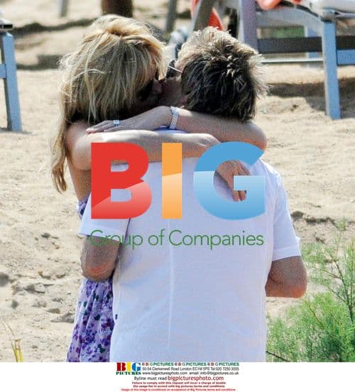 Singer Rod Stewart and Penny Lancaster on Italian beach