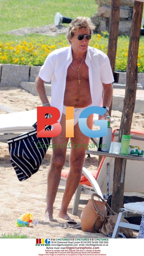 Rod Stewart and family on beach in Italy