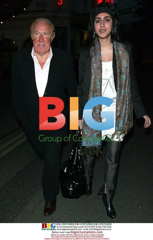 Andrew Neil arrives with friend