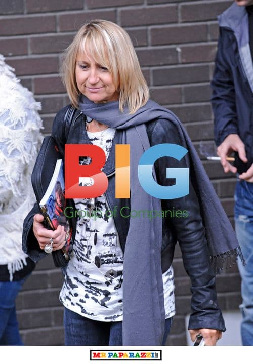 Carol McGriffin carries Bear Grylls book