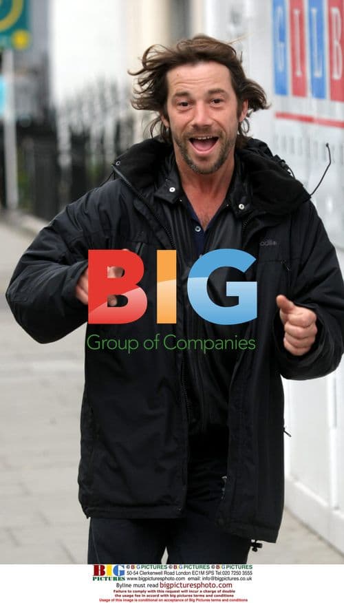 Jay Kay in a hurry jogging with cigarette