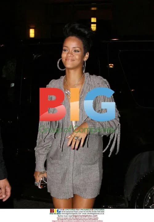 Rihanna Drops Phone at Black Eyed Peas Album Launch