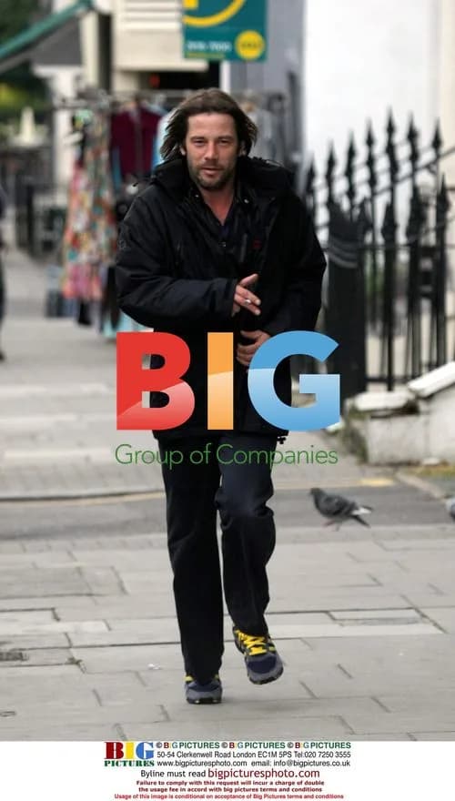 Jay Kay jogging with cigarette in London