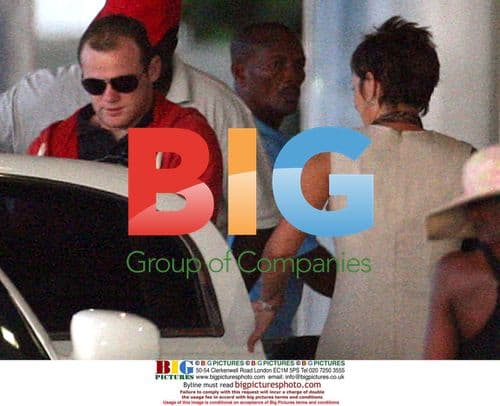 Wayne Rooney and wife Coleen at Barbados airport