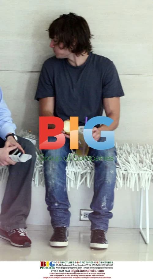 Zac Efron enjoys iced tea and apple at meeting